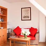 Apartment With Balcony Under The Roofs Of Paris