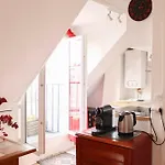 Apartment With Balcony Under The Roofs Of Paris
